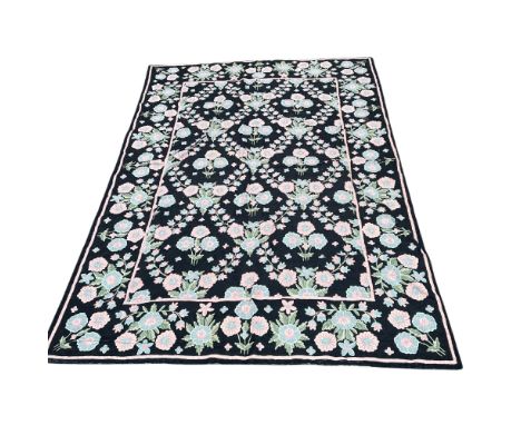 A Bessarabian style chainstitch carpet, 20th century, the charcoal field with an all over floral trellis design, 260 x 184cm.