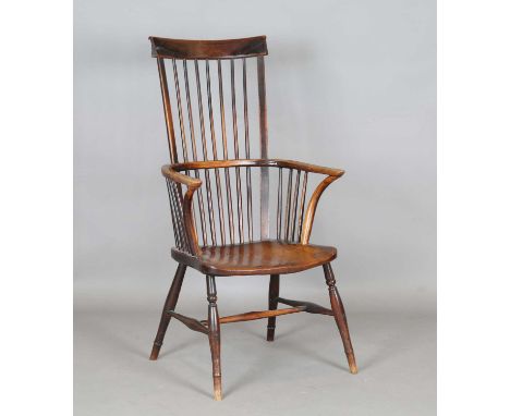 A mid-19th century provincial ash and elm bar and stick back Windsor armchair with a wide elm seat and turned legs, height 11