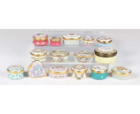 A collection of Halcyon Days and other modern enamel patch boxes and an egg.