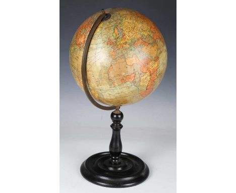 An early 20th century 'Geographia 10 inch Terrestrial Globe', raised on an ebonized stand, height 46cm.