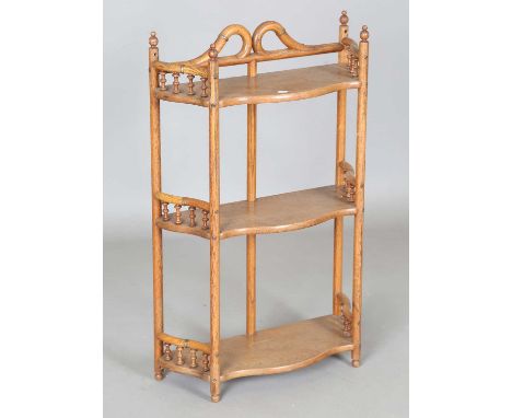 An early 20th century ash and bentwood three-tier wall shelf with applied gilt metal mounts, height 72cm, width 46cm, depth 1