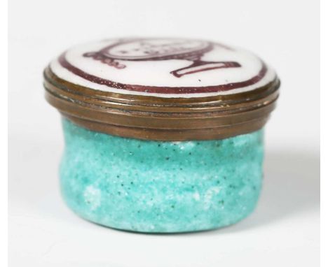 A small late 18th century Bilston enamel patch box, the lid inscribed 'A Friends Gift', diameter 2.2cm.