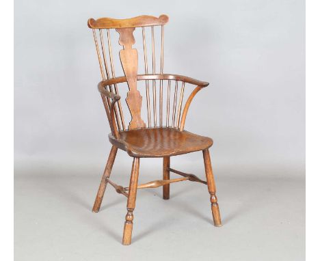 A mid-19th century provincial fruitwood and elm splat and stick back Windsor armchair, height 100cm, width 54cm, depth 56cm.