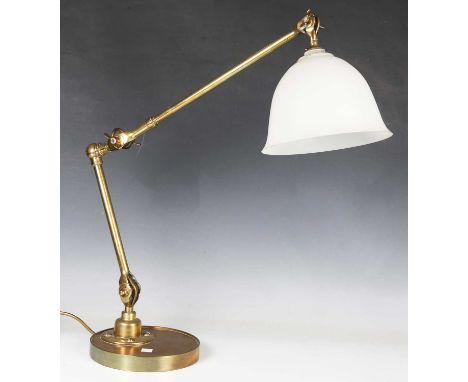 A 20th century brass adjustable table lamp with frosted glass shade, diameter of base 19cm (crack to shade).