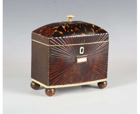 A Regency tortoiseshell and ivory mounted tea caddy, the domed lid enclosing a twin-lidded interior, the front with a radiati