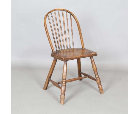 A mid-19th century primitive fruitwood and ash stick back Windsor side chair, height 83cm, width 43cm.