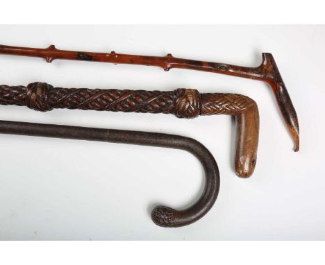 A 19th century boxwood walking stick, the handle carved with 'Milly to Mary', length 92cm, an unusual tinplate walking stick 