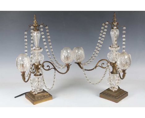 A pair of late 19th century gilt brass and cut glass mounted two-light candelabra, hung with bead swags, height 47cm, width 2