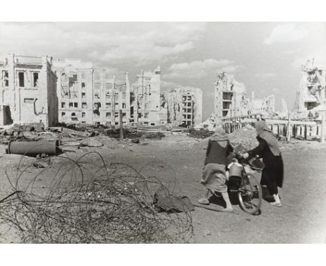  ZELMA, GEORGY (1906-1984) Residents of Stalingrad Walking through the Liberated City . Gelatin silver print, 41 by 60 cm. Ph