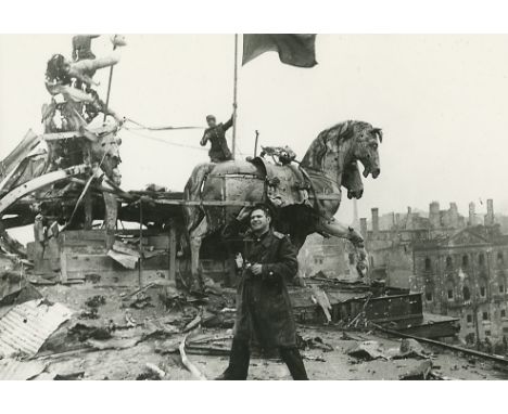  KHALDEI, EVGENY (1917-1997) Red Flag on the Brandenburg Gate in Berlin , signed on the reverse. Gelatin silver print, 24 by 