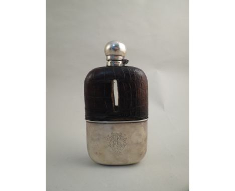 A James Deakin & Sons silver and crocodile skin hip flask with crested mark, stamped Sheffield 1885, 19cm tall