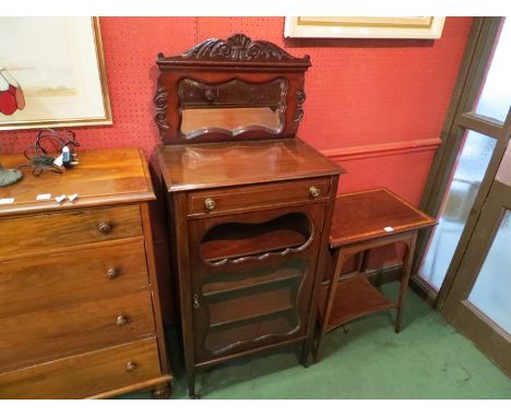 An Edwardian mahogany cabinet the raised mirror back with carved decoration over a single drawer and glazed door on square ta