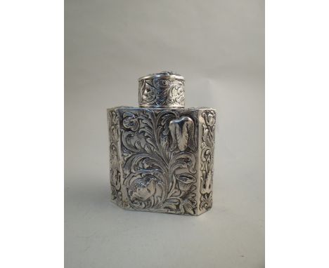 A John George Piddington silver tea canister with all over embossed floral detail in the Art Nouveau style.  Import marks for