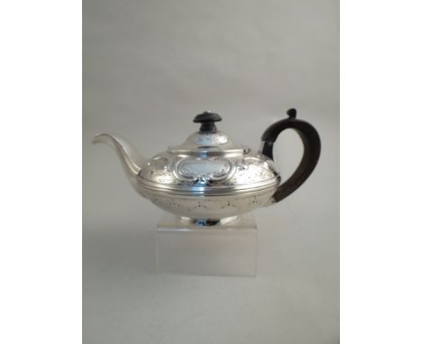 A circa 1825 - 1830 Barber, Cattle & North, York silver teapot with treen knop and handle, engraved and embossed body, marks 