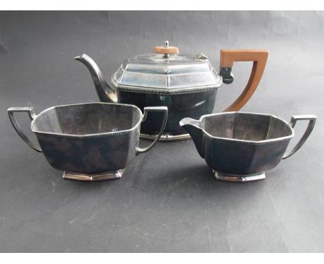 An Art Deco three piece teaset with Bakelite handle 