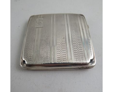 A silver card case with engine turned detail, monogrammed, stamped Birmingham 1912, 95g