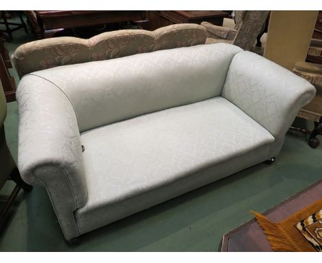 A Victorian drop-end sofa on ball feet in pale green damask style upholstery