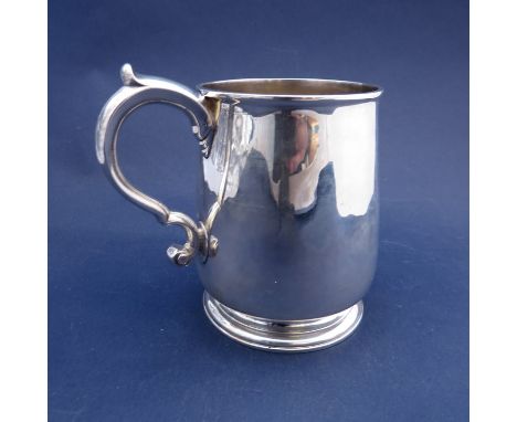 A George II silver tankard with S-scroll handle and stepped circular base, London 1730, 11cm tall, 279g