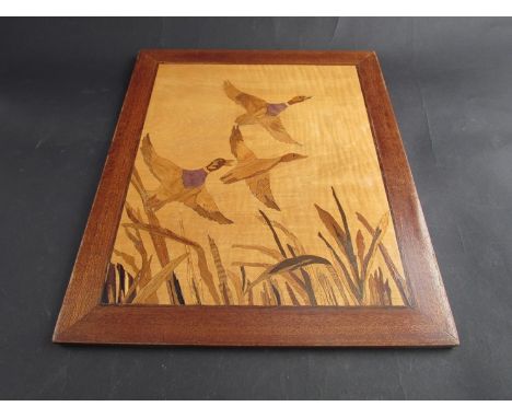 A woodblock marquetry panel of flying geese 