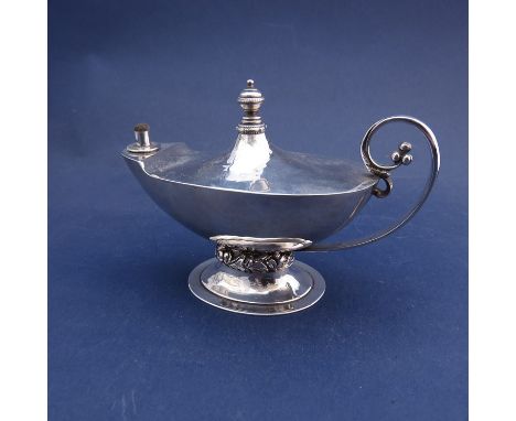 A Charles Boyton silver table Aladdin lamp cigar lighter with embossed decorated base, London 1937, 226g