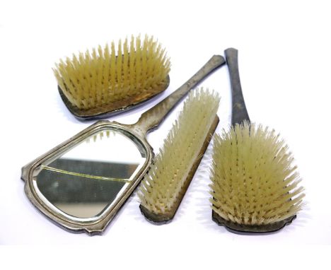 Hallmarked silver backed three piece dressing table set and similar brush. P&amp;P Group 2 (£18+VAT for the first lot and £3+