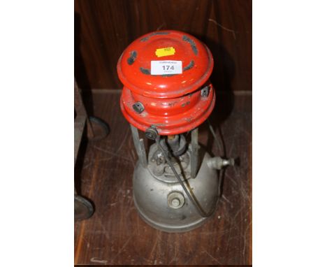 AN OIL BURNING LANTERN