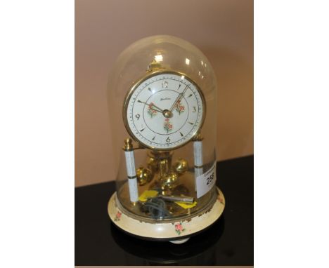A BENTIMA GLASS DOME SKELETON MANTLE CLOCK