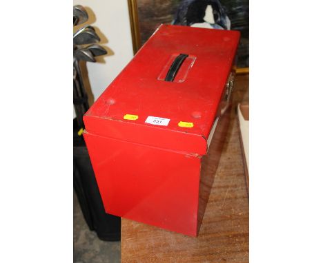 A SMALL RED METAL TOOL BOX