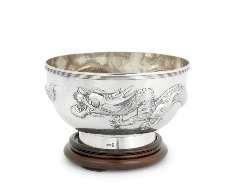 A Chinese silver bowlWang Hing, also with stamped character markPlain hemispherical form with a dragon in high relief, on a c