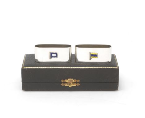 A pair of silver and enamel signal flag napkin ringsGieves Ltd, Birmingham 1936 Oblong form, enamelled with international mar