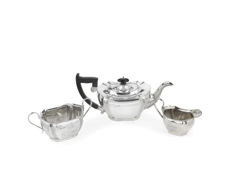 A three-piece silver tea serviceE Viner, Sheffield 1931 Shaped-rectangular form, with matching tongs, length of teapot 31cm, 