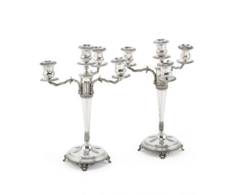 A pair of Greek silver four-light candelabraearly 20th century The removable nozzles with leaf and dart borders, the filled c