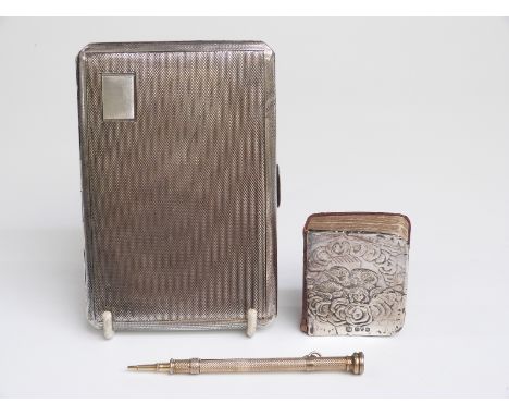 A hallmarked silver cigarette case with engine turned decoration, weight 194g, a hallmarked silver book covered depicting che