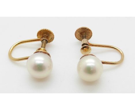 A pair of 9ct gold earrings set with a pearl to each, in original Garrard & Co box 