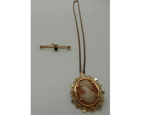 An 18ct gold pendant set with a cameo on a yellow metal chain and a 9ct gold brooch set with sapphire and pearl, 9.32g