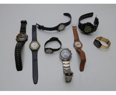 Six Swatch wristwatches including chronograph and day-date examples together with a Casio G-Shock Zombie Slayer wristwatch an