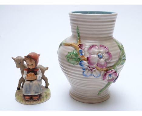 Clarice Cliff vase and a Goebel figure, 18cm tall