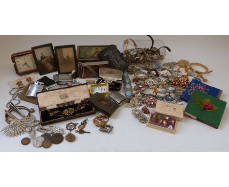 A collection of costume jewellery to include brooches, necklaces, Ronson lighter, watches, enamel brooches, paste brooches et