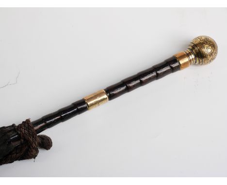 A late 19thC/20thC parasol with yellow metal handle and collar on bamboo stick, 91cm