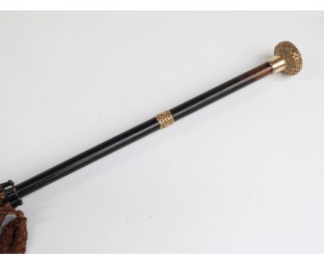 A late 19thC/20thC parasol with 18ct gold plated handle and collar on ebonised stick, 87cm