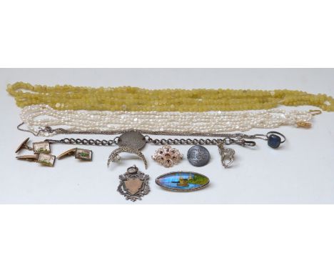 A hallmarked silver fob with yellow metal shield pearl necklace, quartz necklace, silver brooch set with garnets, silver brac