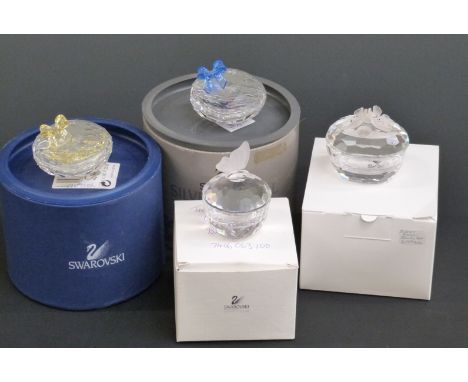 Four Swarovski Crystal cut glass trinket boxes, largest 6cm in diameter, in original boxes