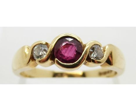 An 18ct gold ring set with a ruby of approximately 0.3ct and two diamonds, size N/O, 4.7g 