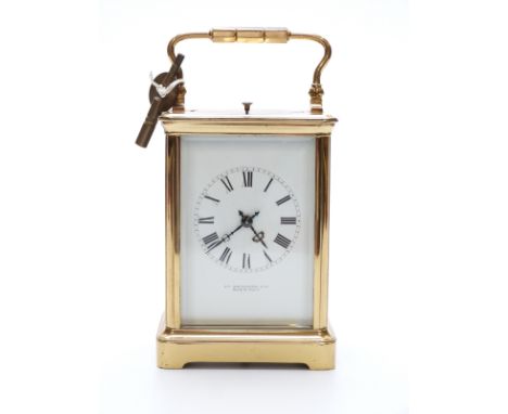 Late 19th / early 20thC gilt brass French carriage clock in corniche style case, the Roman enamelled dial with beetle style b