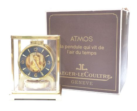 Jaeger-LeCoultre Atmos clock in gilt brass case, the Arabic and baton numerals contrasted on a matt black chapter ring, 22.5c