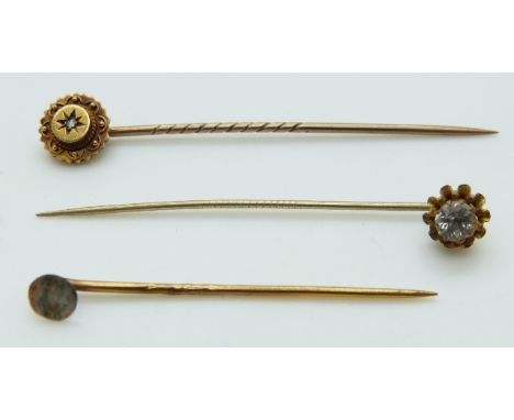 Victorian 15ct gold stick pin set with a diamond, 1.7g and another stick pin