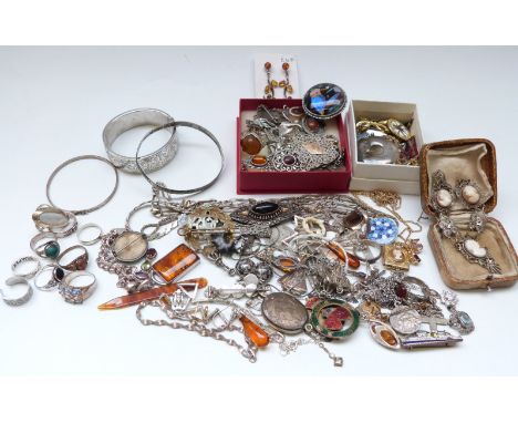 A silver bangle, brooches including silver set with butterfly wing, white metal and Scottish silver thistle example, pressed 