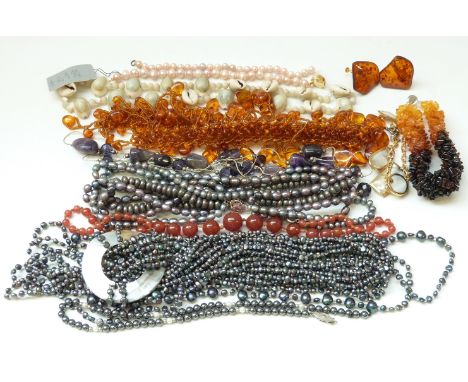 An amber bracelet, pressed amber necklace, shell and pearl necklaces etc 