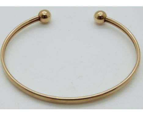 A 9ct gold bangle, 5.9g