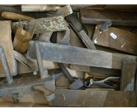 A quantity of vintage woodworking tools including planes, squares etc
